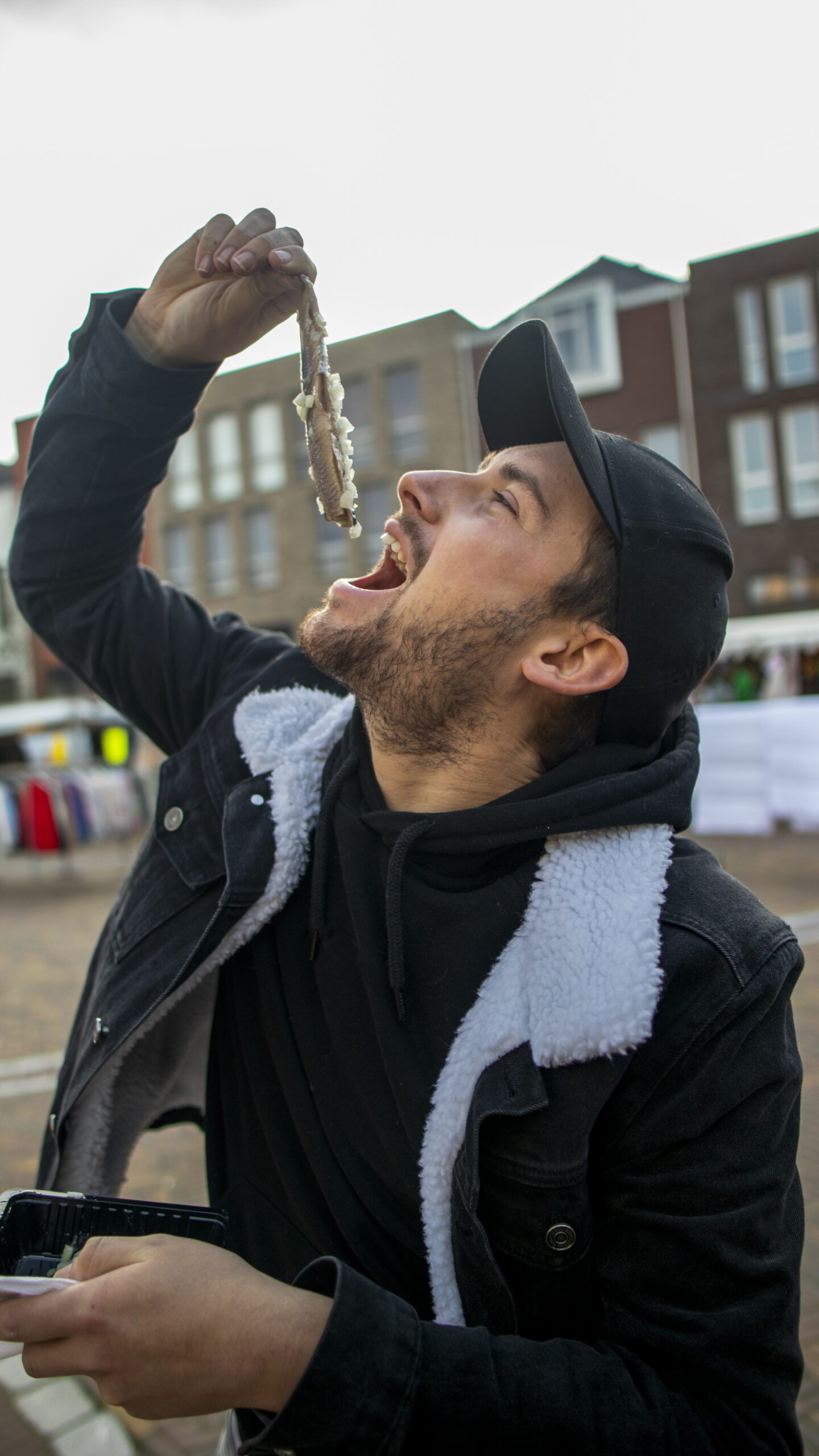 eating dutch herring