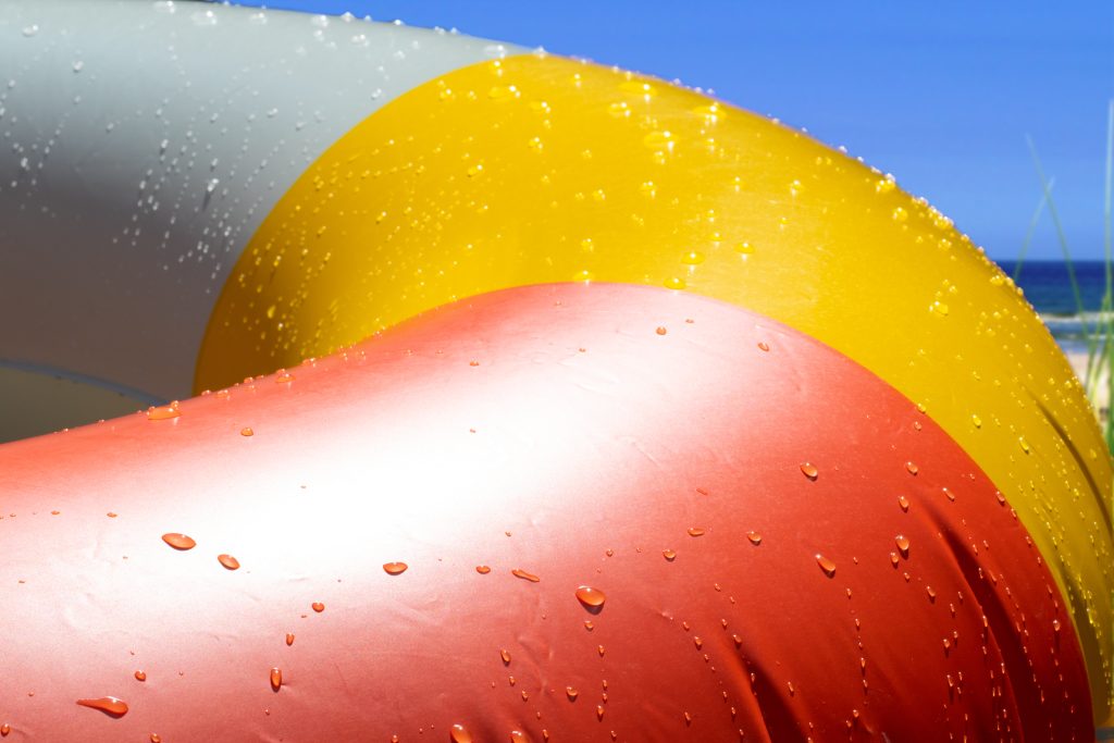 Inflatable swim ring with water drops in summer