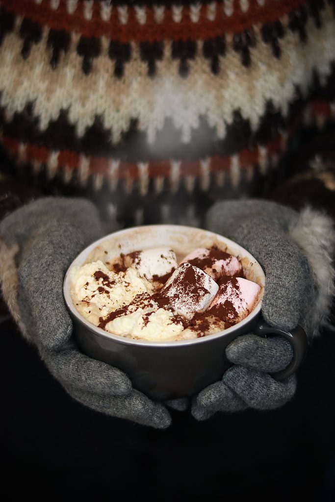 girl hold warm cup of hot chocolate