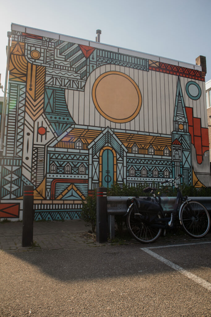 Dutch house with graffiti and bikes in front