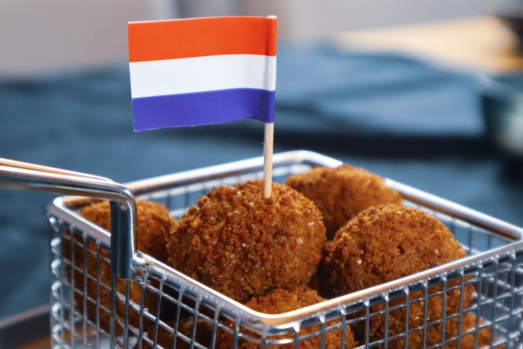 Bitterballen in fryingbasket with Dutch flags