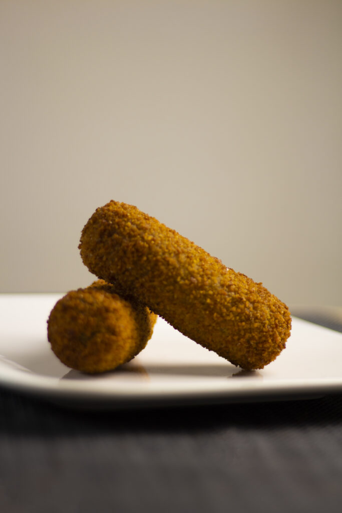 Croquettes on white plate