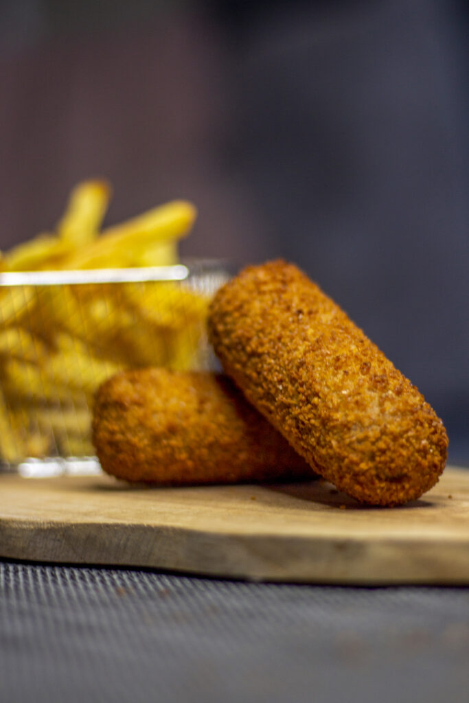 Croquettes with fries close-up