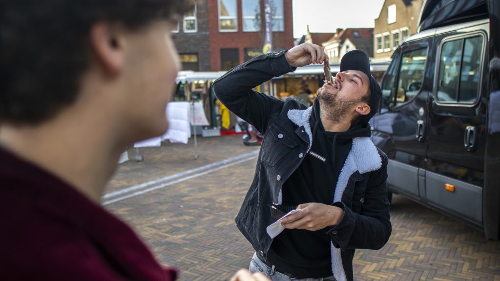 Guy eating a herring