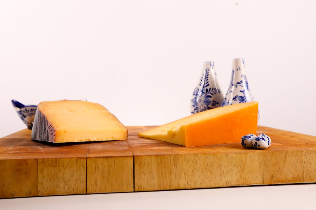 Dutch cheese and Delfts Blue on wooden tray