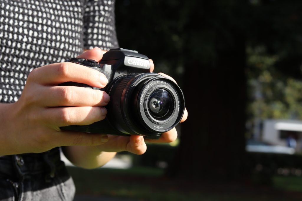 Woman Holding Camera