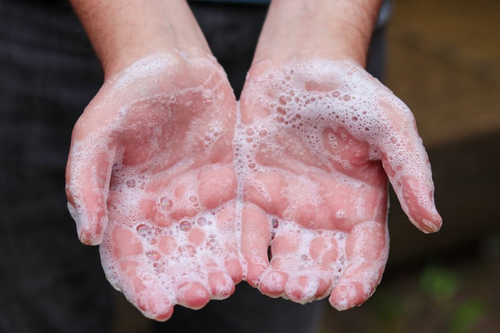 lot of soap on hands close up