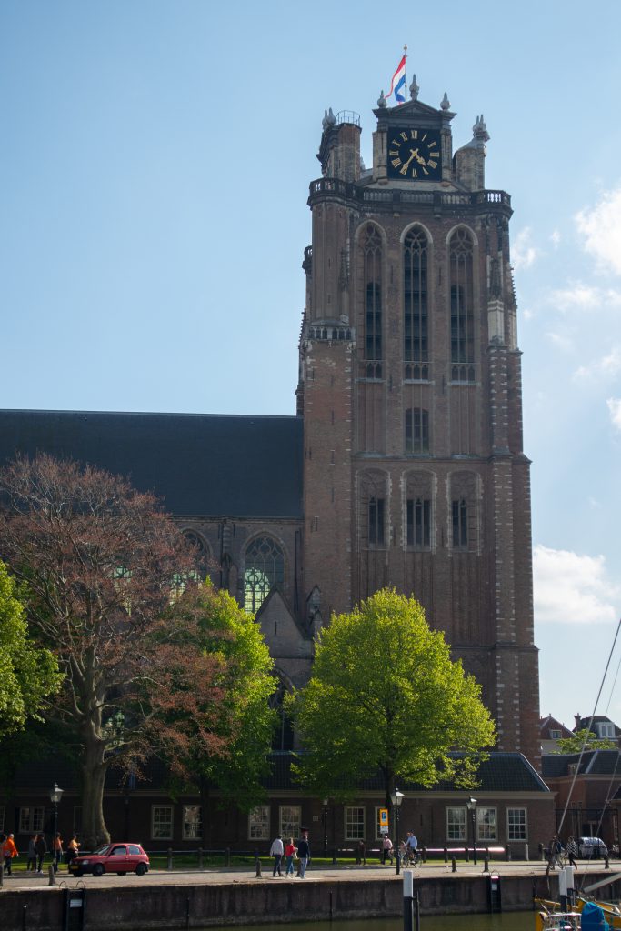 Church Tower in Delft with dutch flag