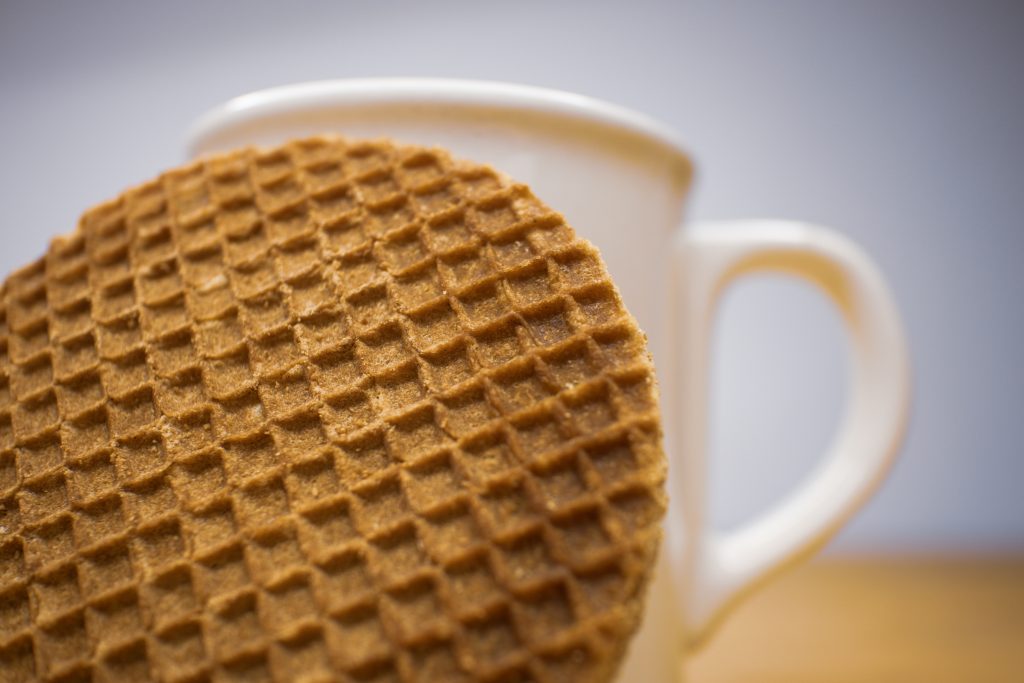 Stroopwafel close up with mug in background