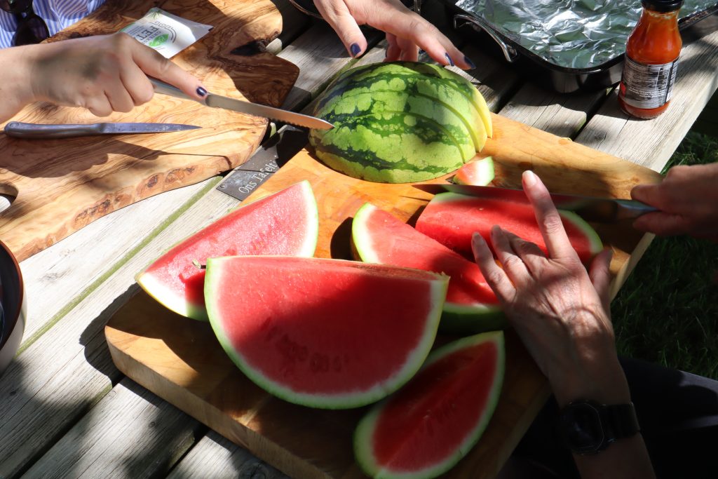 Juicy watermelons being cut