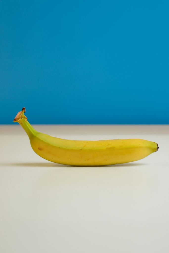 Long banana with blue background
