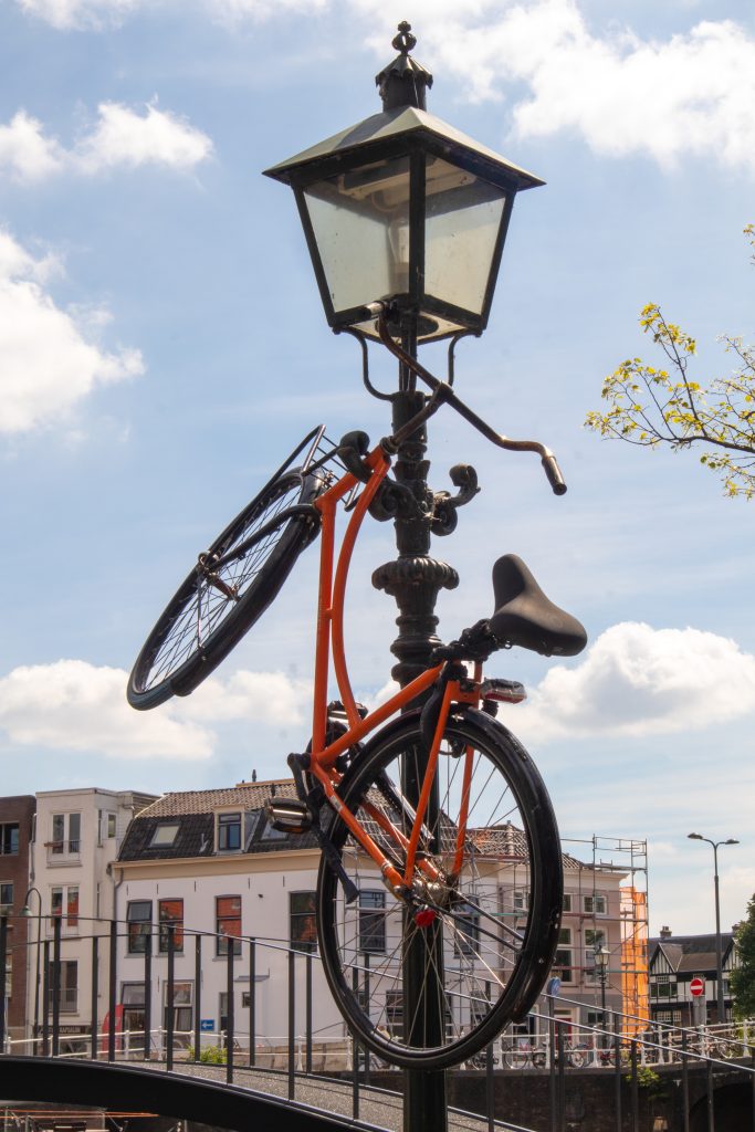 City bike hanging from a lamppost